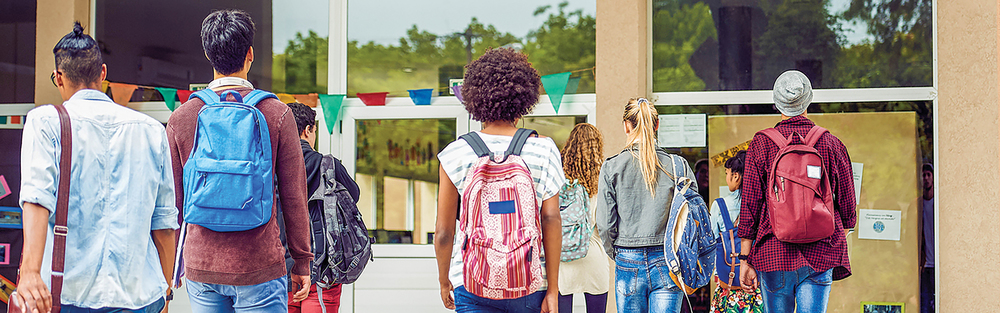 Student walking towards a school